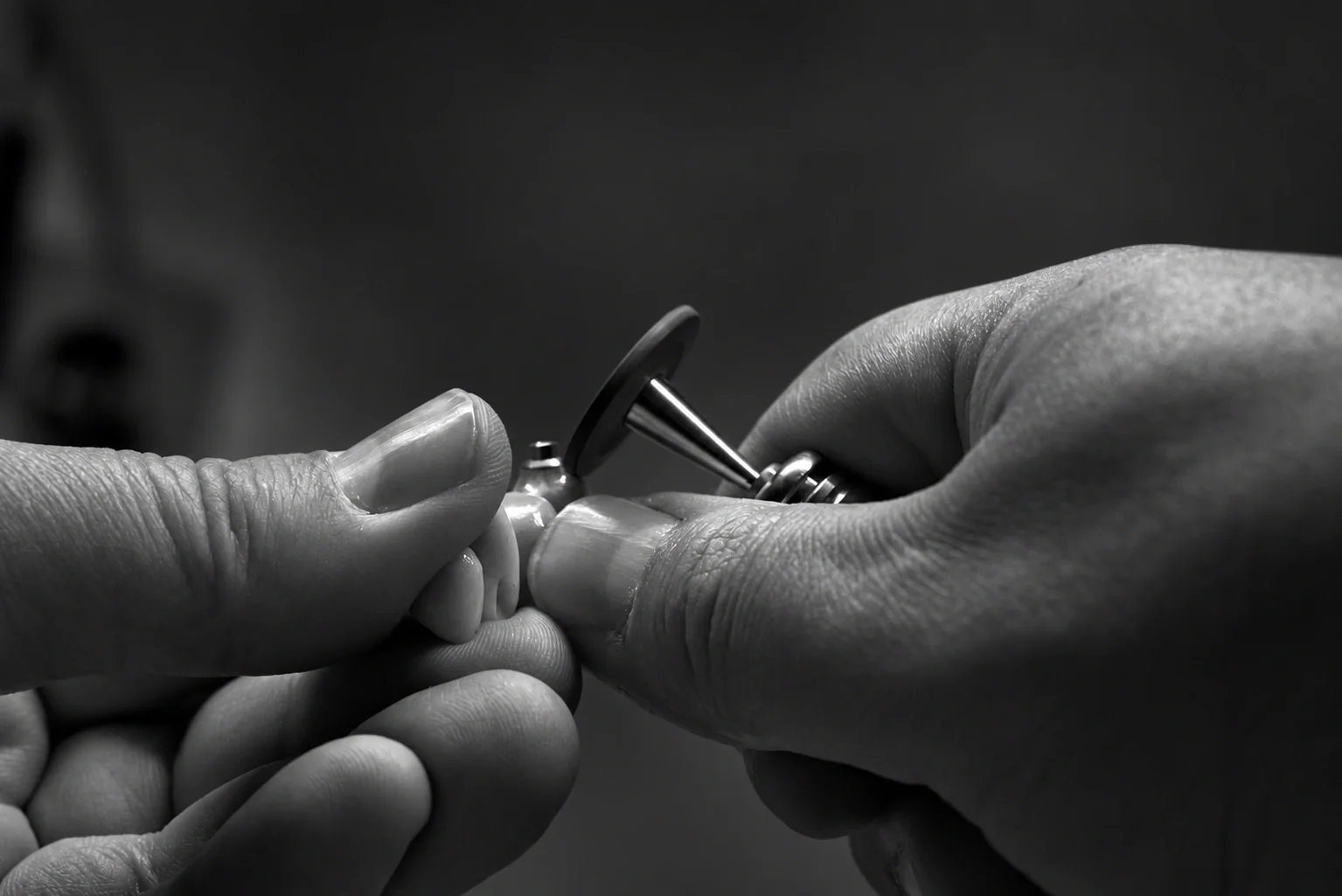 Close-up of a restoration being finished by hand